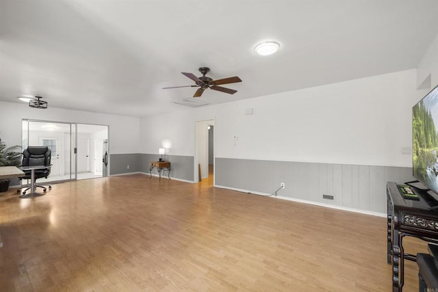 3168 Florine Dr, Lemon Grove, CA 91945 - living room featuring light wood-style flooring, a wainscoted wall, and ceiling fan