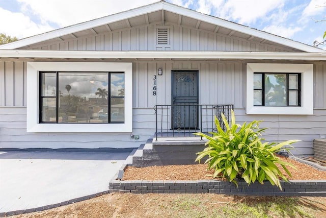 3168 Florine Dr, Lemon Grove, CA 91945 - view of front of home featuring covered porch and board and batten siding