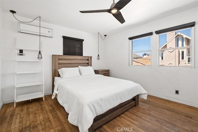 210 39th St, Newport Beach, CA 92663 - bedroom with a wall unit AC, wood finished floors, baseboards, and a ceiling fan