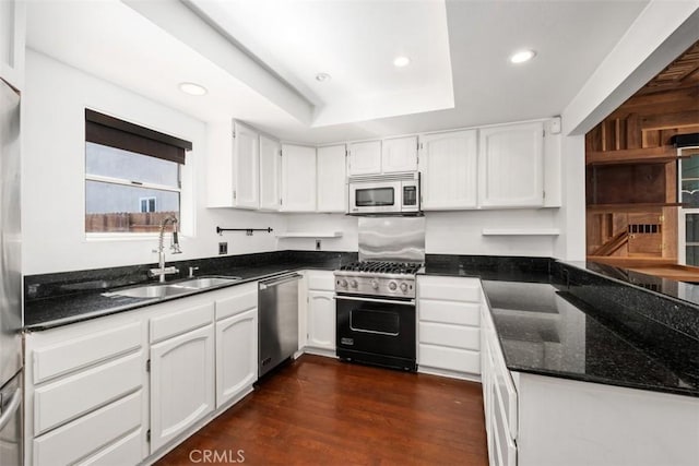 210 39th St, Newport Beach, CA 92663 - kitchen featuring stainless steel appliances, a sink, recessed lighting, white cabinets, and dark stone countertops