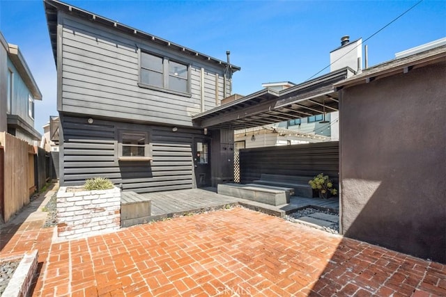 210 39th St, Newport Beach, CA 92663 - back of property featuring a fenced backyard and a patio area