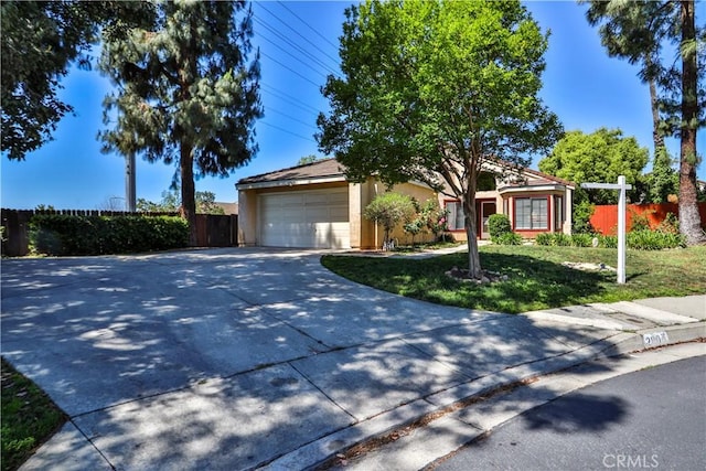 2003 Springcreek Cir, Upland, CA 91784 - obstructed view of property featuring stucco siding, concrete driveway, and an attached garage