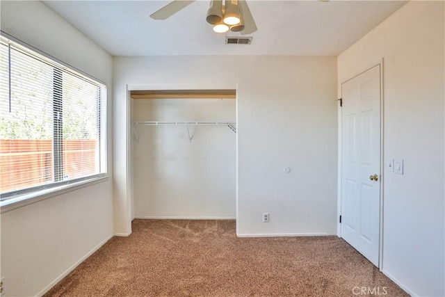 2003 Springcreek Cir, Upland, CA 91784 - unfurnished bedroom with carpet floors, a closet, baseboards, and a ceiling fan