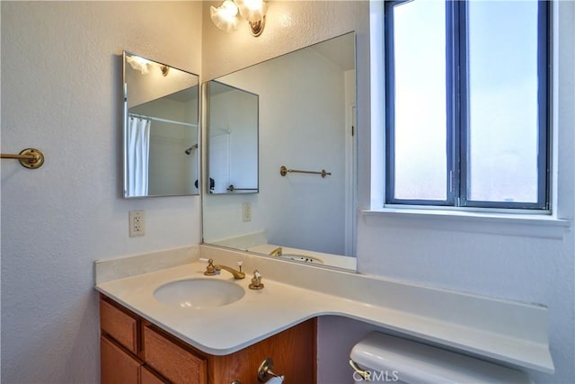 2003 Springcreek Cir, Upland, CA 91784 - bathroom with toilet, vanity, and a textured wall