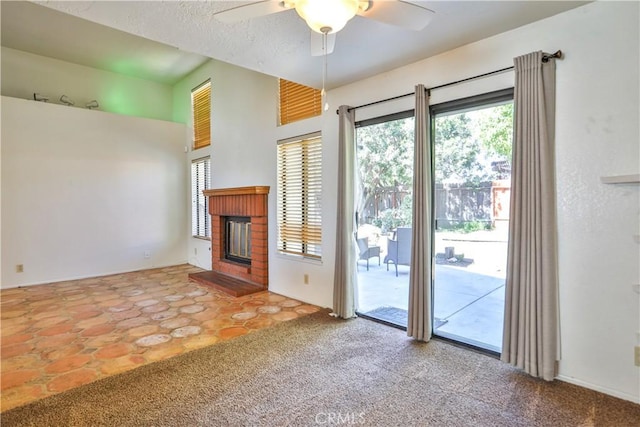 2003 Springcreek Cir, Upland, CA 91784 - unfurnished living room featuring healthy amount of natural light, a ceiling fan, a brick fireplace, and carpet