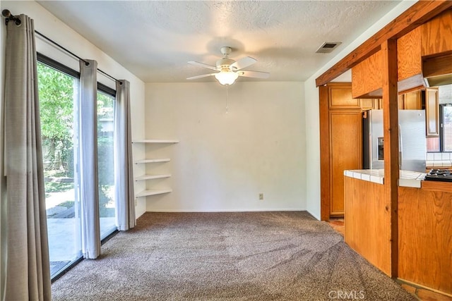 2003 Springcreek Cir, Upland, CA 91784 - unfurnished room with carpet flooring, ceiling fan, and a textured ceiling