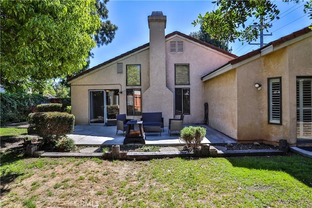 2003 Springcreek Cir, Upland, CA 91784 - back of property featuring a patio area, stucco siding, a chimney, and a lawn