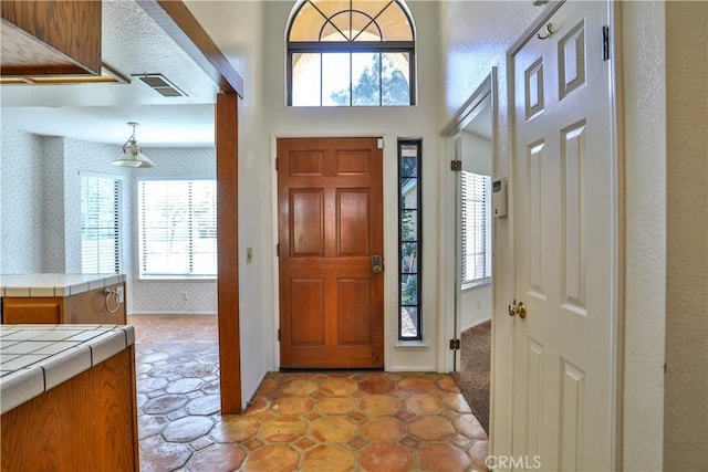 2003 Springcreek Cir, Upland, CA 91784 - foyer entrance featuring healthy amount of natural light and wallpapered walls