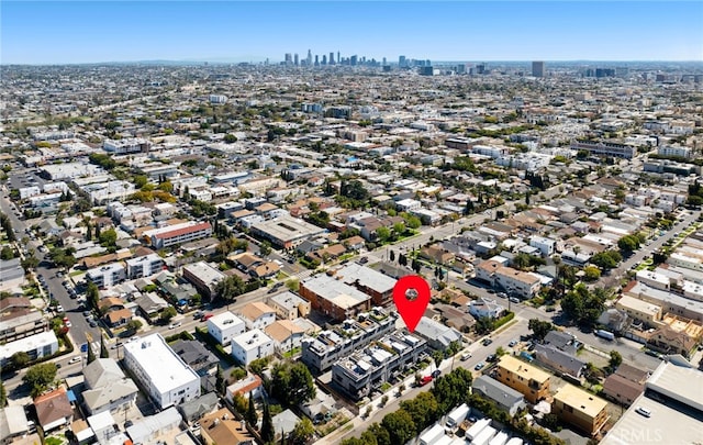 birds eye view of property featuring a city view