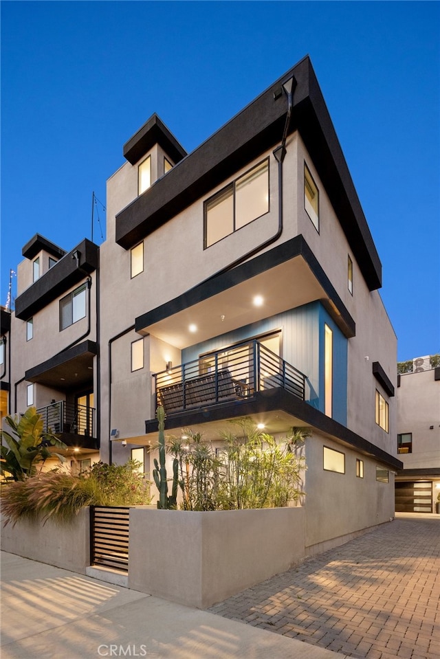 back of property with stucco siding