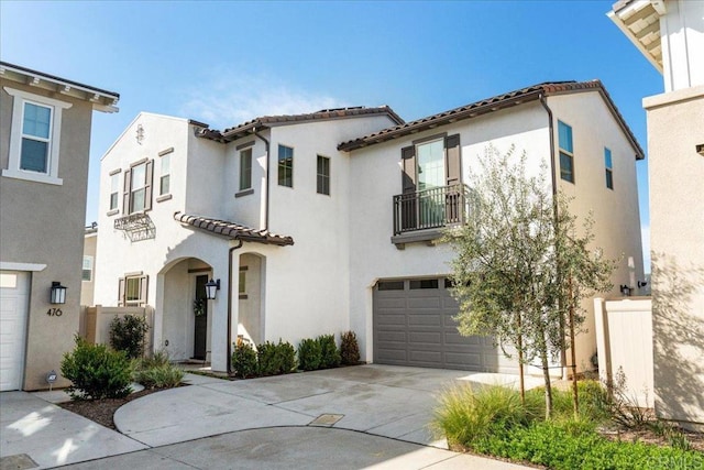 mediterranean / spanish-style house with stucco siding and a balcony