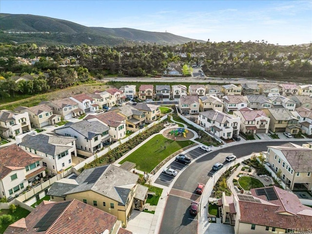 drone / aerial view with a residential view and a mountain view
