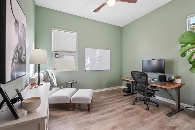 home office featuring baseboards, a ceiling fan, and wood finished floors