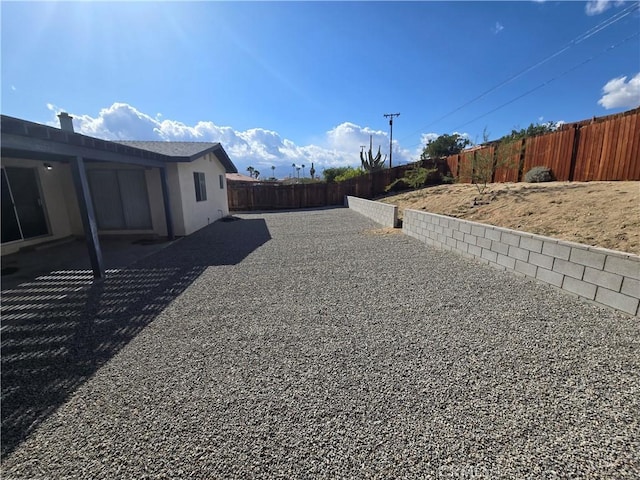 view of yard featuring a fenced backyard and a patio