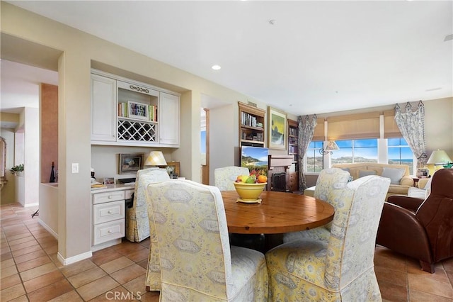 dining space featuring baseboards, recessed lighting, and light tile patterned floors