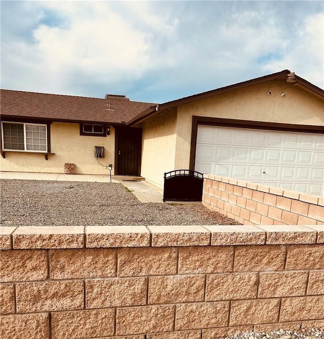 6252 Maloof Ave, Fontana, CA 92336 - ranch-style home with an attached garage and stucco siding