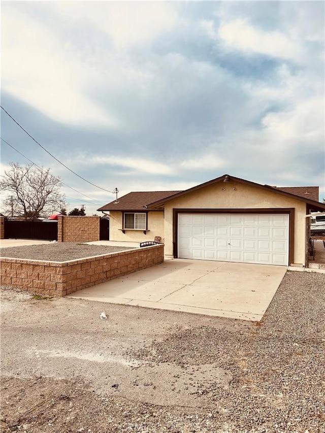 6252 Maloof Ave, Fontana, CA 92336 - single story home featuring an attached garage, driveway, and stucco siding
