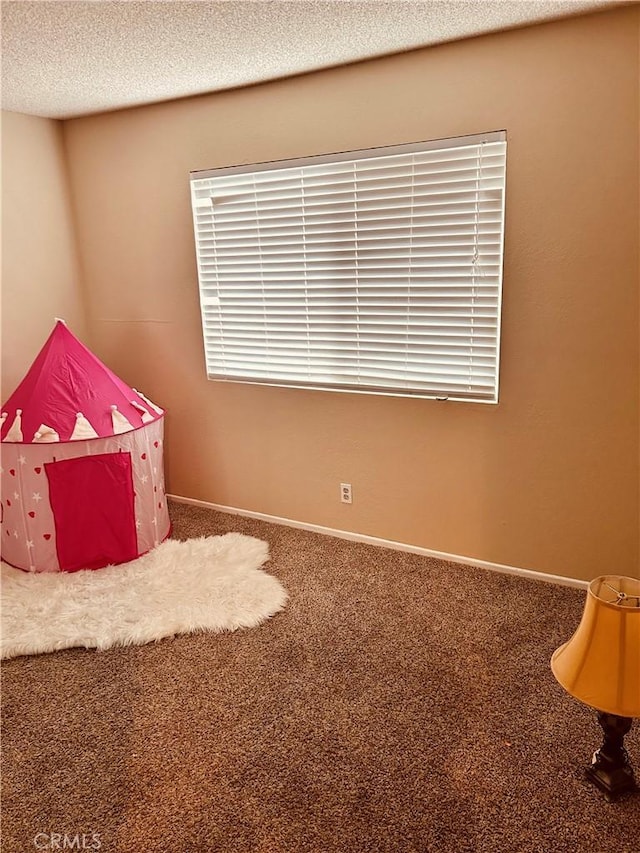6252 Maloof Ave, Fontana, CA 92336 - playroom featuring a textured ceiling and carpet
