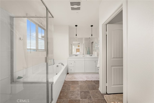 full bath featuring a garden tub, visible vents, a stall shower, and vanity