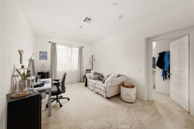 office area featuring light colored carpet and visible vents