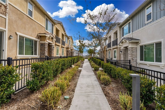 surrounding community featuring a residential view and fence