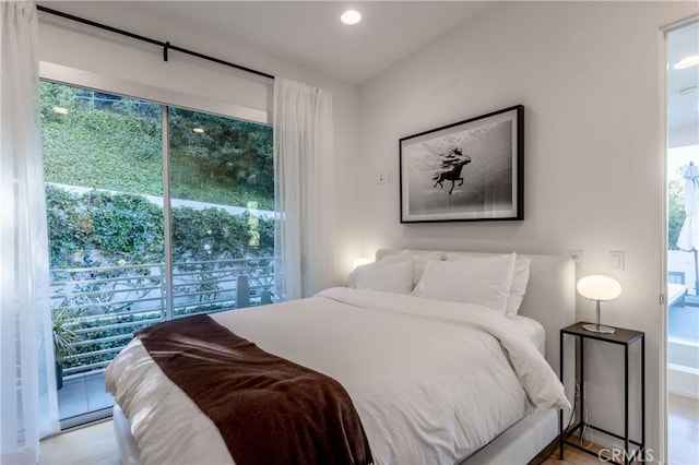 bedroom with access to exterior and recessed lighting