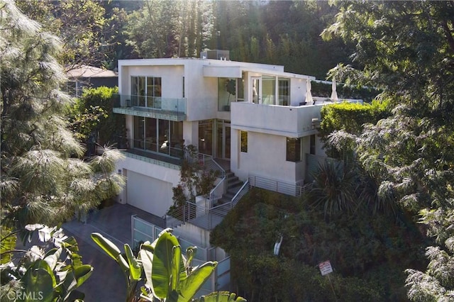 exterior space featuring a forest view