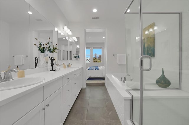 full bathroom featuring a shower stall, tile patterned flooring, a sink, and visible vents