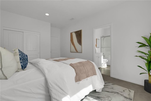 carpeted bedroom with recessed lighting, a closet, and connected bathroom