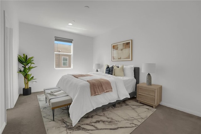carpeted bedroom featuring baseboards