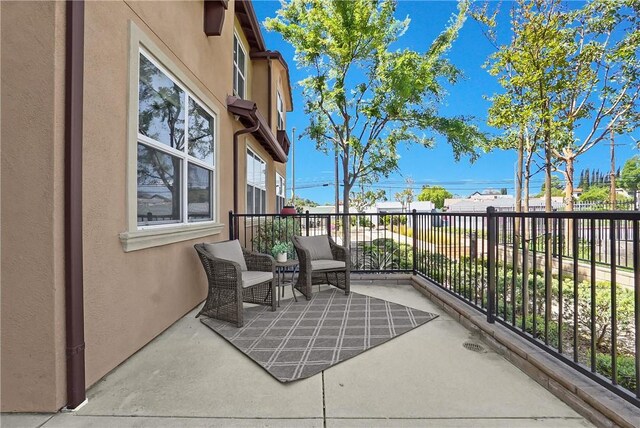 view of patio / terrace with a balcony
