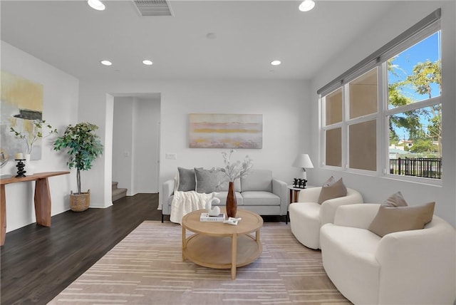 living room with recessed lighting, stairway, visible vents, and wood finished floors