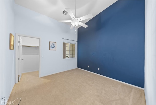 74119 Academy Ln E, Palm Desert, CA 92211 - unfurnished bedroom with carpet floors, a walk in closet, a closet, baseboards, and ceiling fan