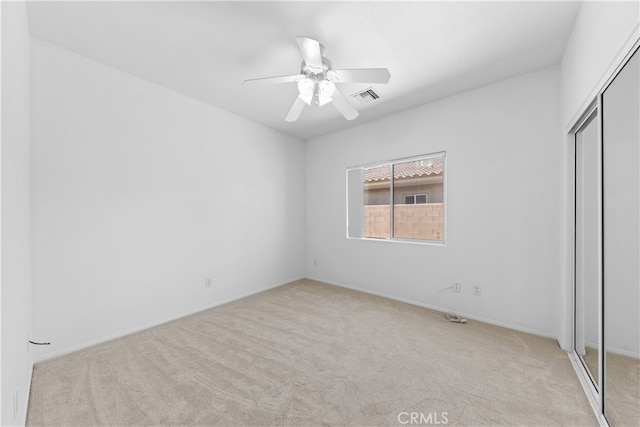 74119 Academy Ln E, Palm Desert, CA 92211 - unfurnished bedroom with carpet, a closet, a ceiling fan, and baseboards