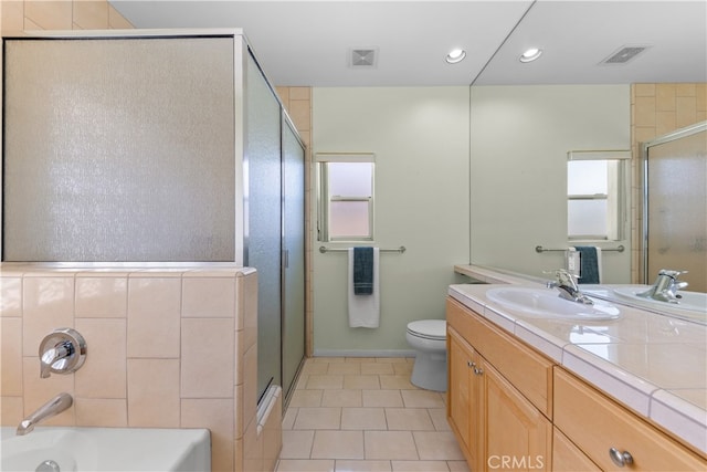 74119 Academy Ln E, Palm Desert, CA 92211 - full bathroom with tile patterned floors, a shower with shower door, vanity, a tub, and toilet