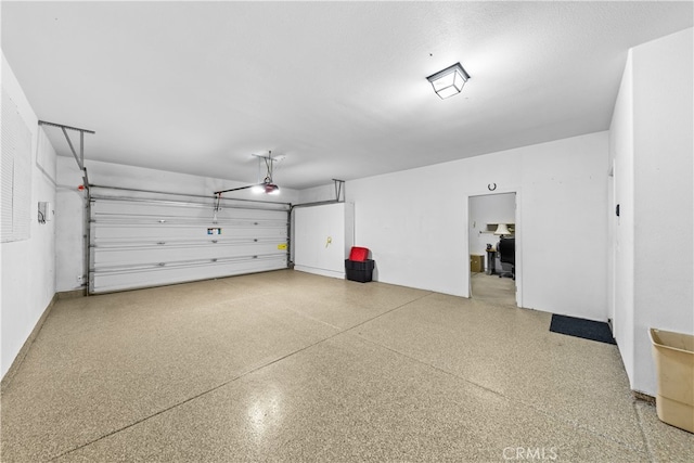 74119 Academy Ln E, Palm Desert, CA 92211 - garage featuring a garage door opener