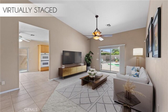 74119 Academy Ln E, Palm Desert, CA 92211 - living room with a ceiling fan, light tile patterned flooring, baseboards, and lofted ceiling