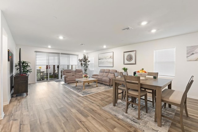 dining room with recessed lighting, light wood finished floors, and visible vents