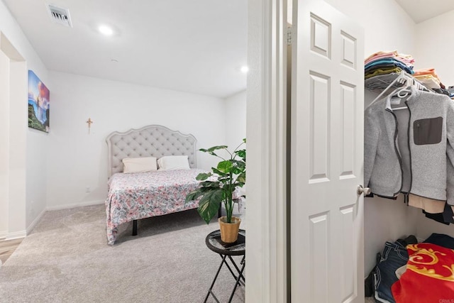 bedroom with carpet flooring, baseboards, and visible vents