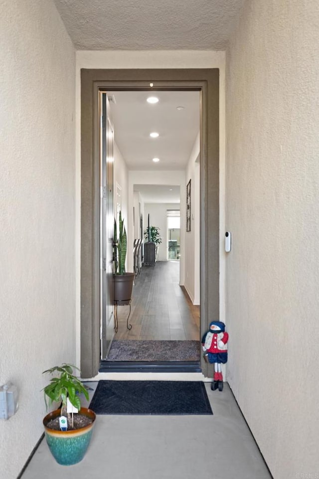 property entrance with stucco siding