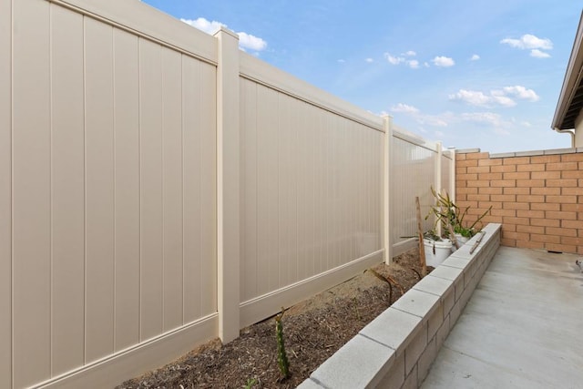 view of side of property with fence