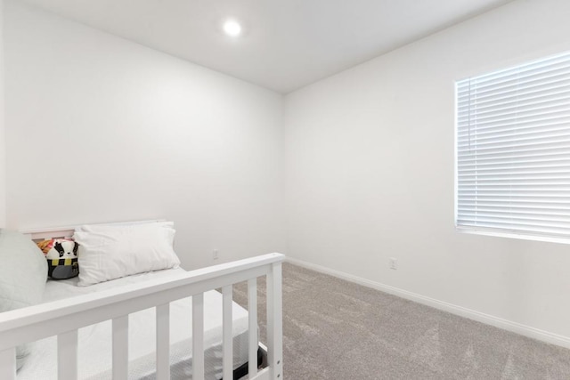 bedroom with recessed lighting, baseboards, and carpet