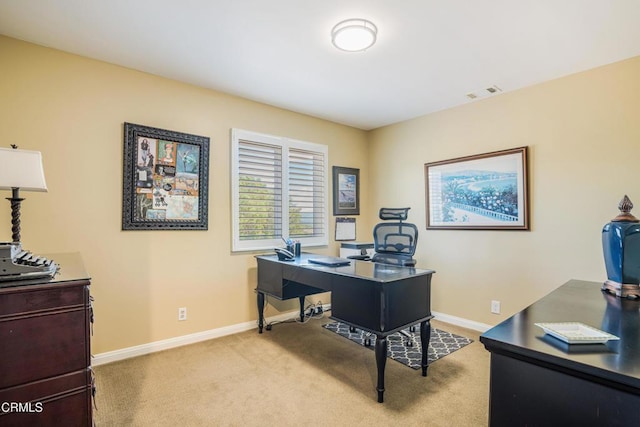 home office featuring baseboards, carpet flooring, and visible vents