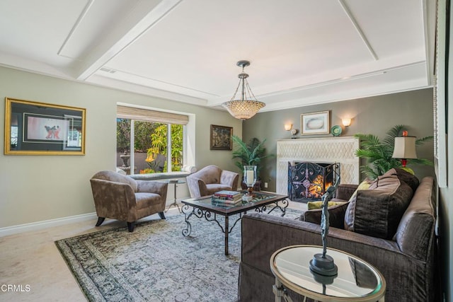 living room featuring baseboards and a fireplace
