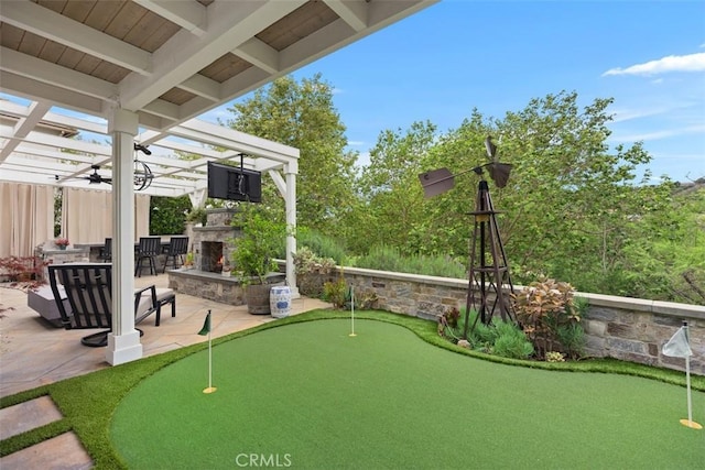 view of community featuring a pergola and a patio area