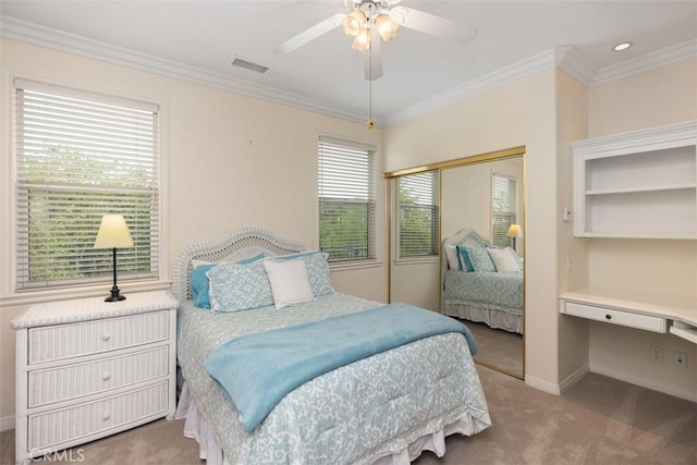 bedroom featuring baseboards, visible vents, carpet floors, and crown molding