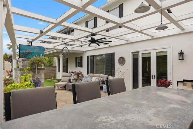 view of patio / terrace with french doors, a pergola, ceiling fan, outdoor dining space, and an outdoor living space