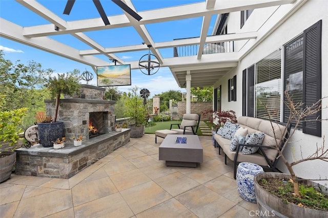 view of patio / terrace featuring an outdoor living space with a fireplace