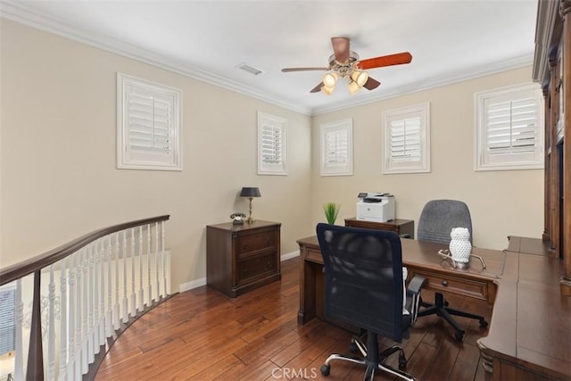 office area featuring ceiling fan, ornamental molding, wood-type flooring, and visible vents