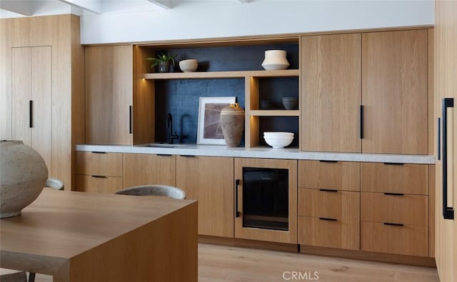 2604 Victoria Dr, Laguna Beach, CA 92651 - kitchen with open shelves, modern cabinets, light wood-style floors, and light brown cabinets